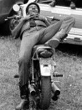 African American Man Relaxing on His Motocycle During Motorcycle Races near Detroit  Michigan
