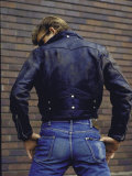 Young Man from Back  Wearing 1950's Fashions: Black Leather Jacket  Sunglasses and Tight Blue Jeans