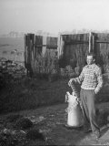 Composer Benjamin Britten Standing at a Small Replica of a Windmill in His Garden