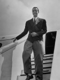 Millionaire Howard Hughes Deplaning at Airport