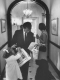 US Attorney General Bobby Kennedy Browsing Copy of the NY Times with daughter and Wife