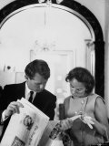Attorney General Robert Kennedy and Wife Looking at Copy of the New York Times