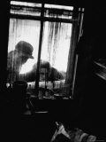 Curiosity Seekers Peering Into Kitchen Window at Alleged Mass Murderer Ed Gein's House