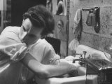 Pianist Glenn Gould Soaking His Hands in Sink to Limber Up His Fingers Before in Studio