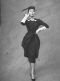 Model Showing Elegant Dress Featuring Tucked Up Apron Designed by Balmain