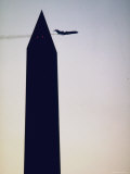 Silhouette of Jet Plane Passing Washington Monument
