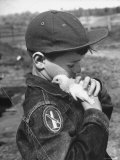 Boy with a Newly Hatched Chicken on a Farm in Maryland