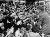 Pres Candidate John Kennedy Reaching Towards a Sea of Outstretched Hands During Campaign Motorcade