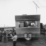 Railroad Construction Worker's Family Watching TV in Trailer at Camp for Southern Pacific Employees