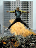 Riff Leaps over Smoldering Rubble of New York Slum Clearance Project in Scene from West Side Story