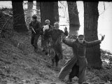 American Soldier Escorting a Group of German Prisoners Somewhere Along the Banks of the Roer River