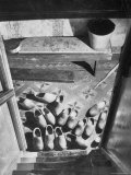 Wooden Shoes in a Hallway at the Bottom of the Stairs