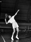 Tennis Player Althea Gibson  Serving the Ball While Playing Tennis
