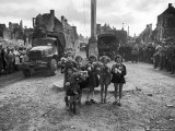 Girls with Bouquets Await the Arrival of French General Charles DeGaulle