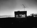 Railroad Construction Worker and Family Watching TV in Trailer at a Camp for Employees