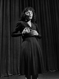 Edith Piaf with Hands on Breast and Midriff