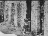 Little West Berliner Tries to Open Sealed Door of House Now Part of Wall Dividing East/West Sectors