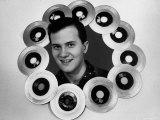 Pop Singer Pat Boone Surrounded by His Hit Records