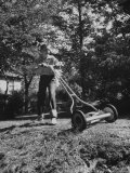 American Boy Mows Lawns to Earn Extra Money During Summer Months  He Gets Jobs Thru Newspaper Ads