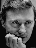 Close Shot of TV Host Merv Griffin Resting His Chin on His Hand While Staring at Something