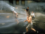 Children Cooling off in the Spray of a Firehydrant on New York City Street