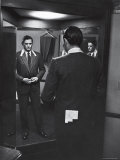 Gregory Peck Trying on Suit for His New Movie Man in the Grey Flannel Suit