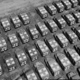 Trucks Parked in Formation on Road and Open Field for Storage Near US Ordinance and Supply Depot