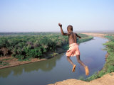 Karo Boy Leaps Off a Cliff Over the Omo River  Ethiopia