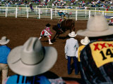Overhead of Bull Rider from the Stands of a Rodeo  Mt Isa  Australia