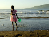 A Girl Walks on the Beach in Jacmel  Haiti  in This February 5  2001