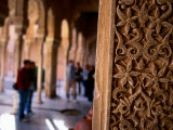 Carved Wall with Tourists in Background  Alhambra  Granada  Spain