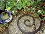 Pebble Patio with Swirl Design Small Mosaic Raised Pond  Plants in Pots  Brighton