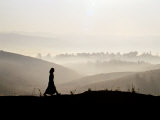 Silhouette of Woman Walking in Morning Mist  Kengtung  Myanmar (Burma)