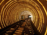 An Empty Tourist Subway Car Runs Through Illuminated Tunnel