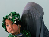 An Afghan Mother Waits with Her Daughter Before Attending Medical Care