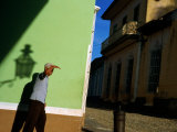 Man Shielding Eyes Whilst Walking Past Wall  Sancti Spiritus  Cuba