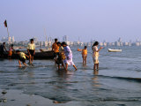 Locals Cooling off in Polluted Waters at Chowpatty Beach  Mumbai  India