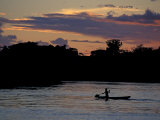 Boaters on Amazon River at Sunset  Amazon River Basin  Peru