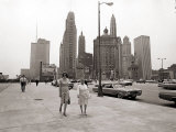 Two Ladies Walking the Sidewalk Skyscrapers in Chicago America's Windy City  in the 1960s