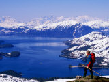 Hiker Overlooking Lake with Mountains in Distance  Prince William Sound  USA