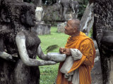 Old Monk Praying at Xieng Khuan (Buddha Park)  Laos