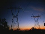 Power Lines and Towers Silhouetted against the Evening Sky