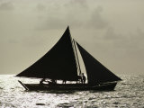 Silhouetted Cat Boat on a Sea of Silver at Twilight