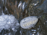 Rock with the Word Imagine in Rushing Water