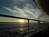 Looking at Sunset Through the Railing on the Deck of a Cruise Ship