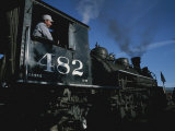 A Steam Engine Engineer Looks Out the Window of the Engine