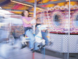 Blur of Girl Riding Carousel
