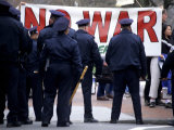 Police Face Protestors Demonstrating against the War in Iraq