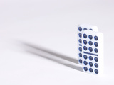 Line of Two Black and White Dominoes Against White Background