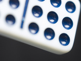 Black and White Domino Against Black Background